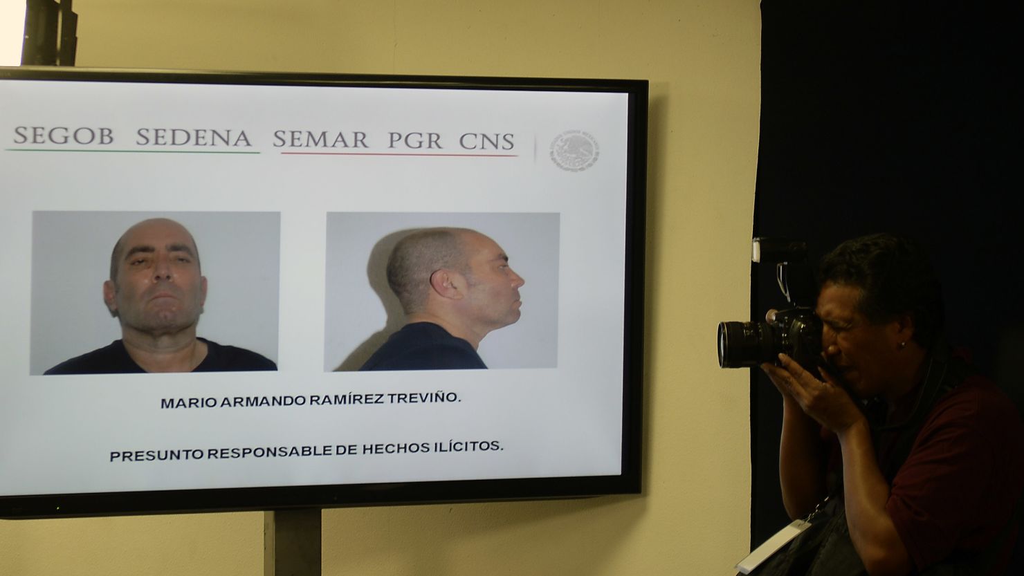Pictures of Mario Armando Ramirez Trevino are presented during a press conference in Mexico City on August 18.