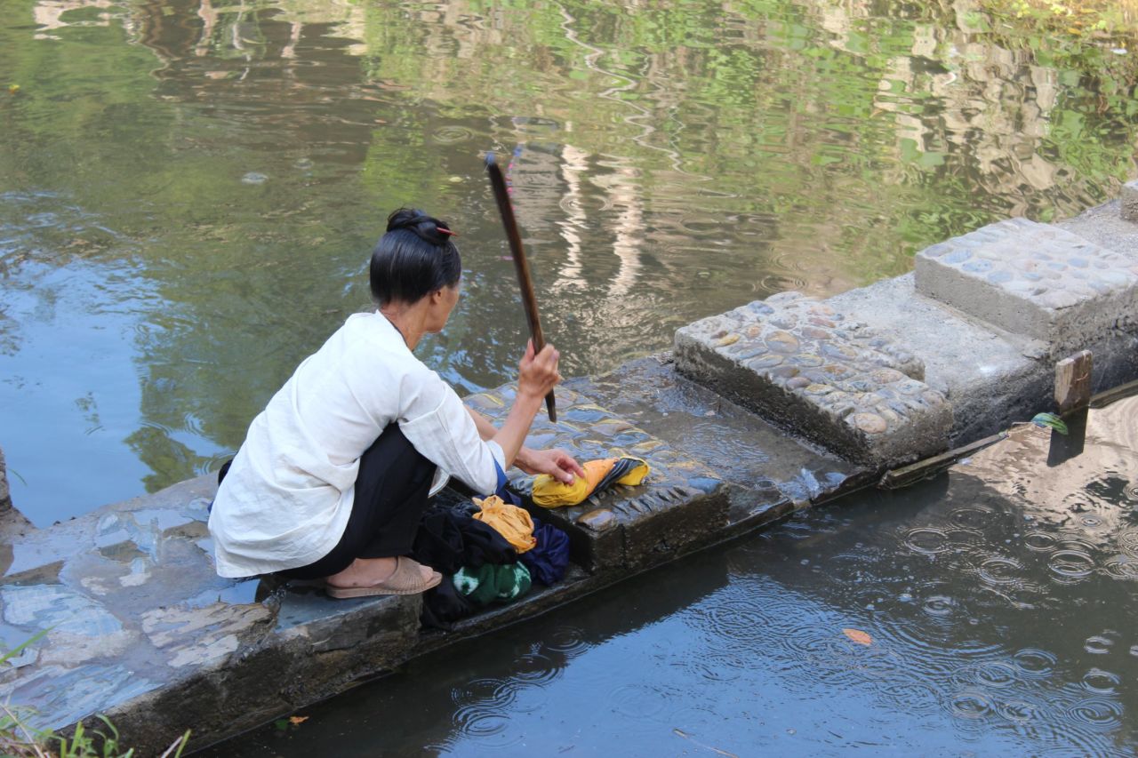 While the houses in Dali village have electricity, not all families can afford appliances like washing machines. Incomes, on average, are less than a third of those in cities.