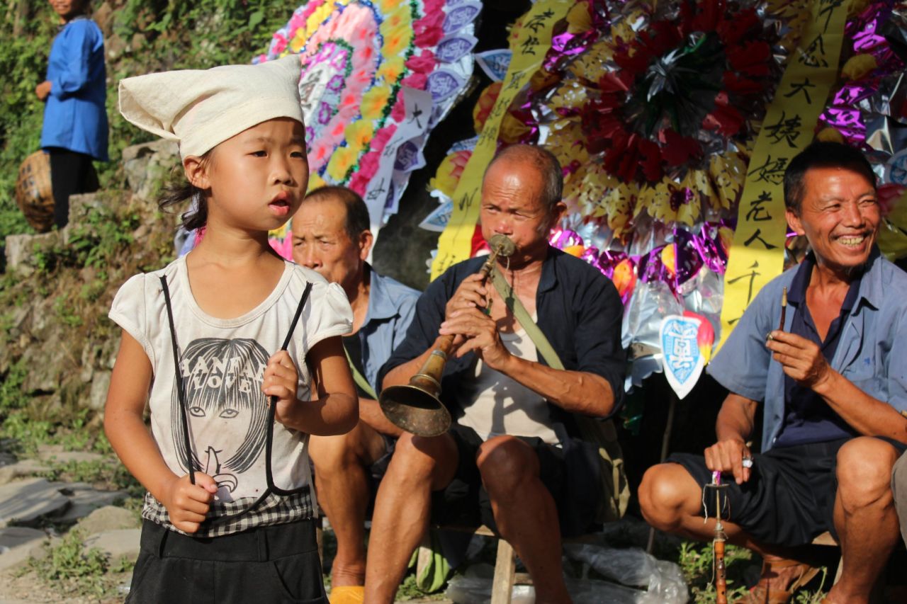 Chinese funerals are noisy affairs, with pipers, wailers and firecrackers