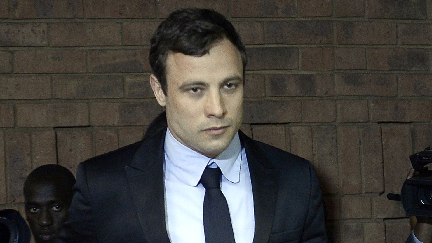 South African Olympic sprinter Oscar Pistorius arrives at the Magistrate Court in Pretoria on August 19, 2013.