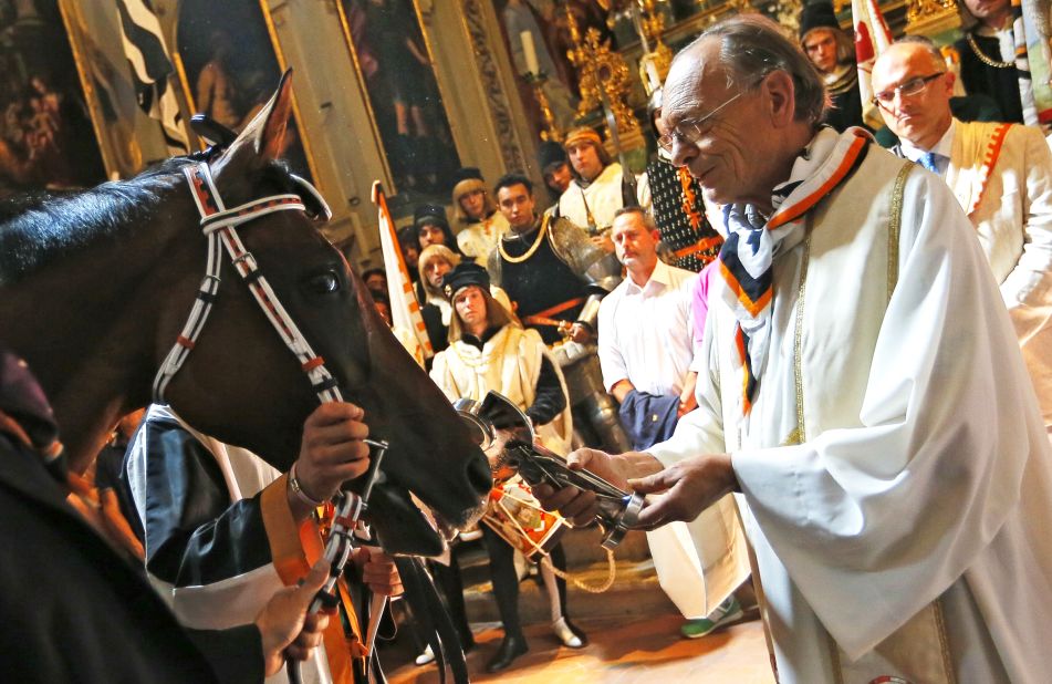 Before the Pailo di Siena riders make their 90-second dash around the city, each horse is blessed by a priest for the race which dates back to the 17th Century.