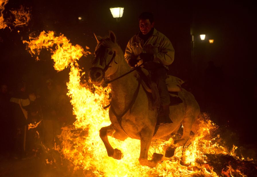 It might look like the Four Horsemen of the Apocalypse, but these horses leaping over bonfires in San Bartolome de Pinares are part of St Anthony's Day eve celebrations. It is believed the animals are purified and protected during the controversial ritual.
