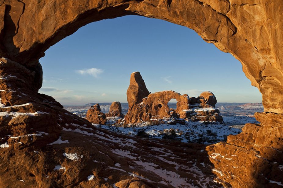Turret Arch, seen here through North Window, is one of three giant arches on the Windows trail. North Window and South Window are arches known together as the Spectacles.