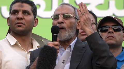 File: Mohammed Badie, center, leader of Egypt's Muslim Brotherhood, addresses supporters in Cairo in July 2013. An Egyptian court upheld the death sentences against Badie and 182 of the Brotherhood's supporters on Saturday.