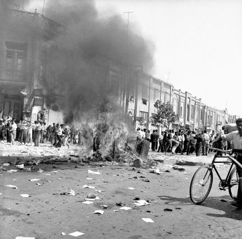 A communist newspaper's office equipment is burned in the streets of Tehran on August 19, 1953, during the pro-Shah riot that swept through Iran's capital. After a day of fighting, Royalist forces triumphed and Prime Minister Mohammad Mossadegh was ousted. A declassified CIA document acknowledges that the agency was involved in the coup.