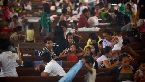 Flood victims take shelter in a church in Manila on August 20.