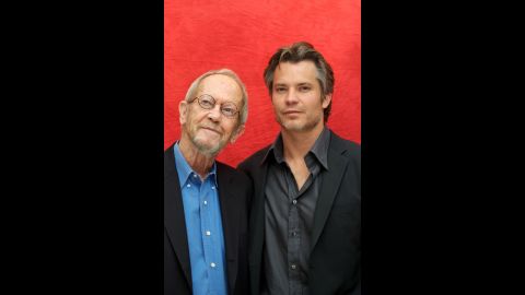 Leonard and Timothy Olyphant pose for photos at a press conference in June 2010 in Beverly Hills. Olyphant stars in the TV series "Justified," which is based on Leonard's novels.