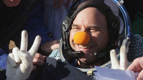 CEO of Cirque du Soleil Guy Laliberte flashes a victory sign shortly after landing with members of the 20th main mission to the International Space Station on October 11, 2009.