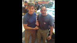 Dr. Mehmet Oz (l) and plumber David Justino (r) assisted at the scene of a car accident when a woman was hit by a taxi cab in New York City.