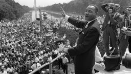 US civil rights leader Martin Luther King,Jr. (C) waves to supporters from the steps of the Lincoln Memorial 28 August 1963 on the Mall in Washington DC (Washington Monument in background) during the 'March on Washington'. 28 August marks the 40th anniversary of the famous 'I Have a Dream' speech, which is credited with mobilizing supporters of desegregation and prompted the 1964 Civil Rights Act. Martin Luther King was assassinated on 04 April 1968 in Memphis, Tennessee. James Earl Ray confessed to shooting King and was sentenced to 99 years in prison. AFP PHOTO/FILES (Photo credit should read AFP/AFP/Getty Images) 
