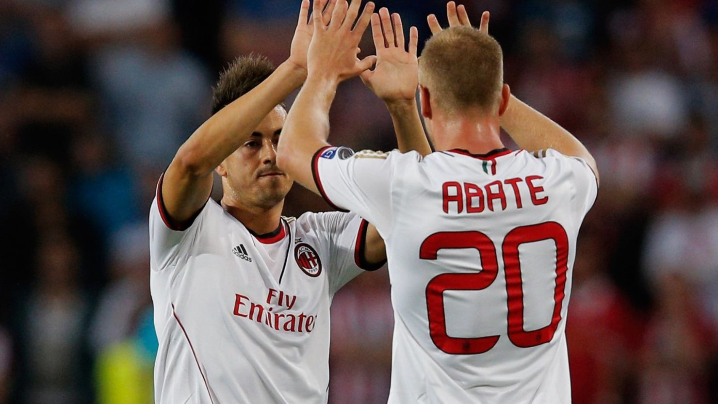 Stephan El Shaarawy celebrates scoring the crucial first goal for Milan teammate Ignazio Abate in the tie against PSV Eindhoven. 