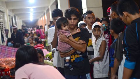 Filipinos take shelter in an elementary school that has been turned into an evacuation center in Marikina City on August 20.