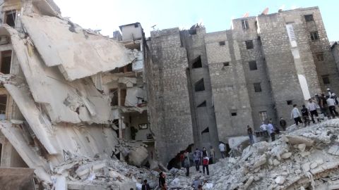 People search the rubble of a bombed building in Aleppo, Syria, on Friday, August 16.