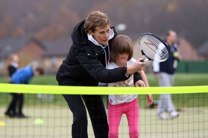 Judy, even when it's chilly, continues to coach kids as she tries to get more youngsters playing and boost the popularity of tennis in Britain. 
