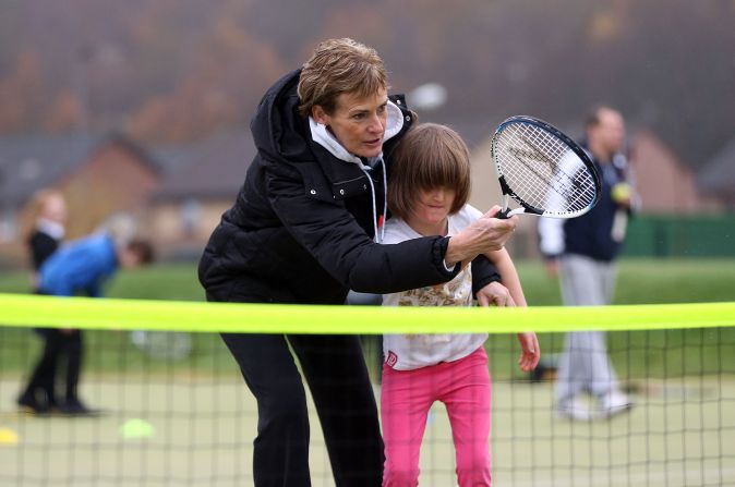 Judy, even when it's chilly, continues to coach kids as she tries to get more youngsters playing and boost the popularity of tennis in Britain.
