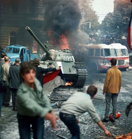 The invasion aimed at stopping the liberalization of the communist regime in Czechoslovakia. Pictured here are Prague residents throwing burning torches in an attempt to stop one of the Soviet tanks in Prague.