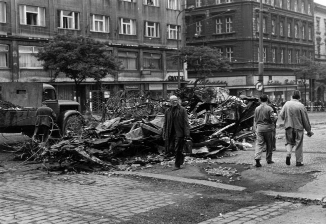 Shortly after the invasion began, the armies took control of the whole country and left scenes of destruction. Pictured here are the remains of barricades erected in Prague.