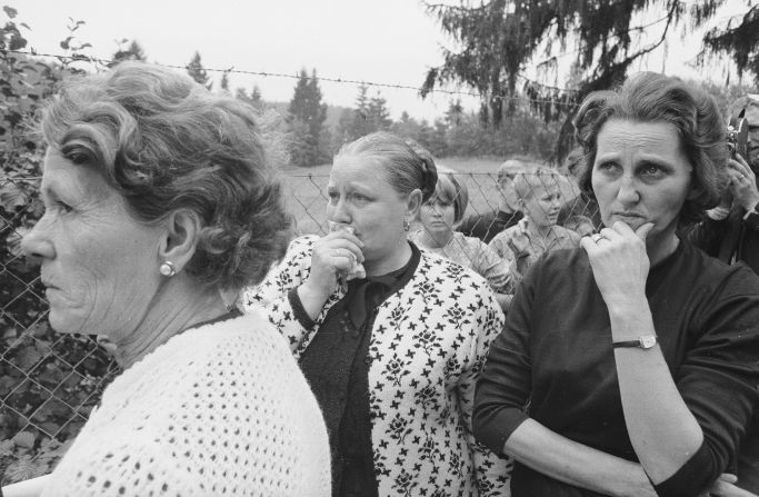 Immediately after the invasion, an estimated 70,000 people fled the country. Eventually, over 300,000 people emigrated. Friends and family of some of the refugees are pictured here at the border between Czechoslovakia and Germany.