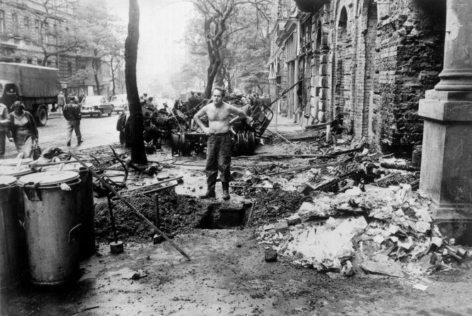  A file photo dated August 31, 1968 of a man standing amidst the damages caused by the confrontations between demonstrators and the Warsaw Pact troops and tanks in Prague. The troops and tanks entered Prague on August 21, 1968 to crush the new found freedom and re-establish a totalitarian regime. 