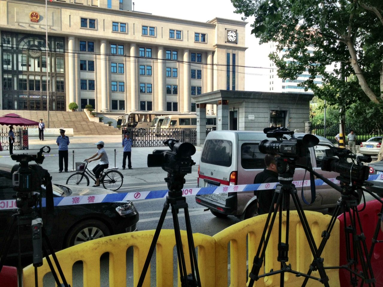 Tight security is in place around the courthouse in Jinan, China, on Wednesday, August 21 -- the day before China's so-called "trial of the century."