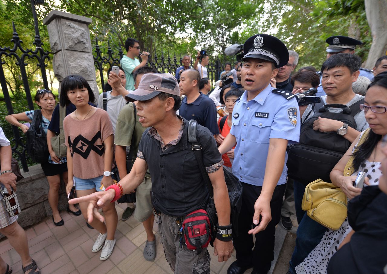 Police escort protesters away from the courthouse on August 21.