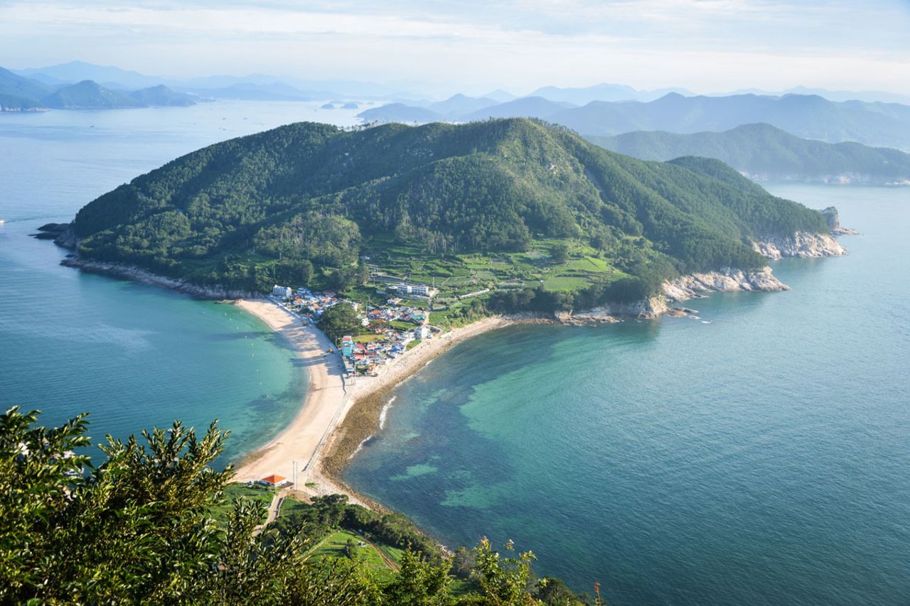A powdery strip of white sand tethers two ends of Bijindo island together. The top of Waesan Mountain offers this great view of the island and surrounding marine park.