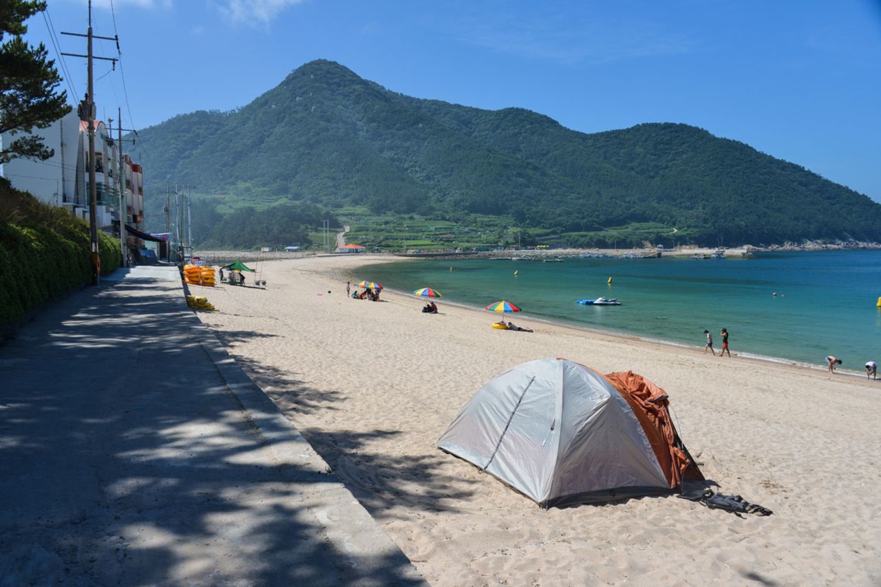 Camping on the beach may be preferable to staying in a hotel, which are scarce on the island. There's a public bathroom and shower just behind the beach. 