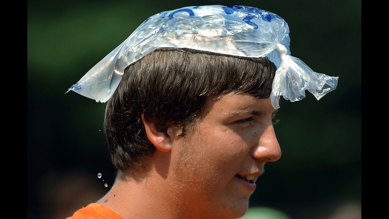 High school senior Matthew Murphy, 17, keeps his head cool with a bag of melting ice during band practice in Dunmore, Pennsylvania, on August 21.