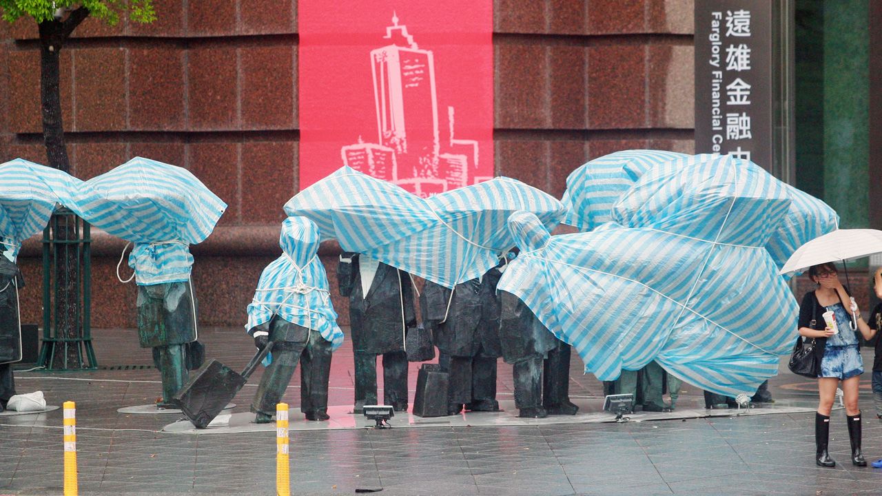 Statues are covered as severe tropical storm Trami approaches on August 21 in Taipei, Taiwan.