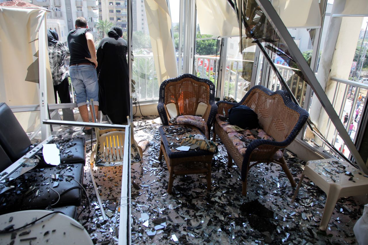 Shattered glass litters the floor of a room near the mosque.
