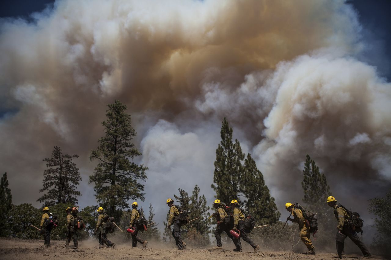 Los Angeles County firefighters hike in on a fire line on the Rim Fire near Groveland, California, on August 22. 
