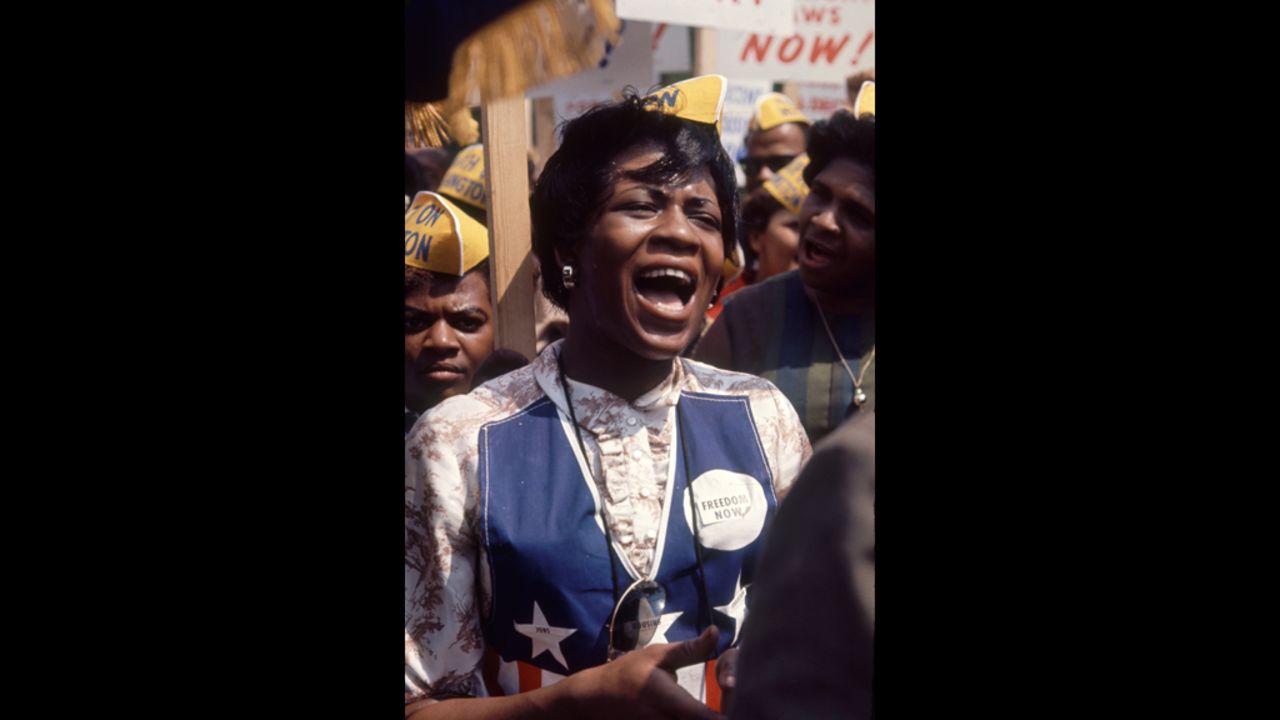 A protester sings at the march.