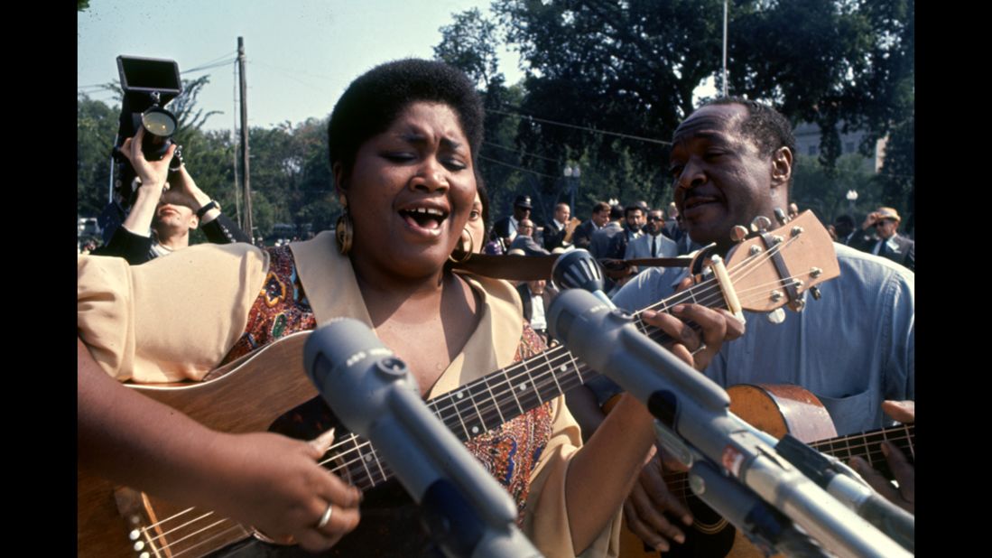 Musician Odetta Holmes plays a song during the march.