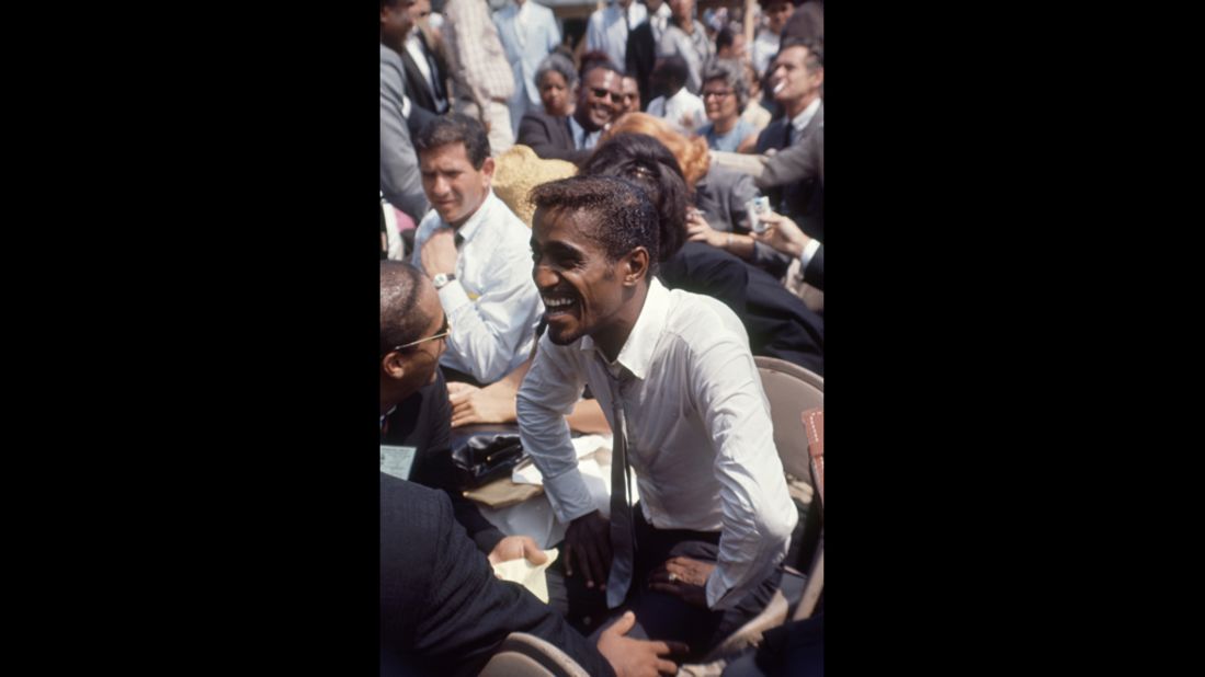 African-American entertainer Sammy Davis Jr. attends the rally.