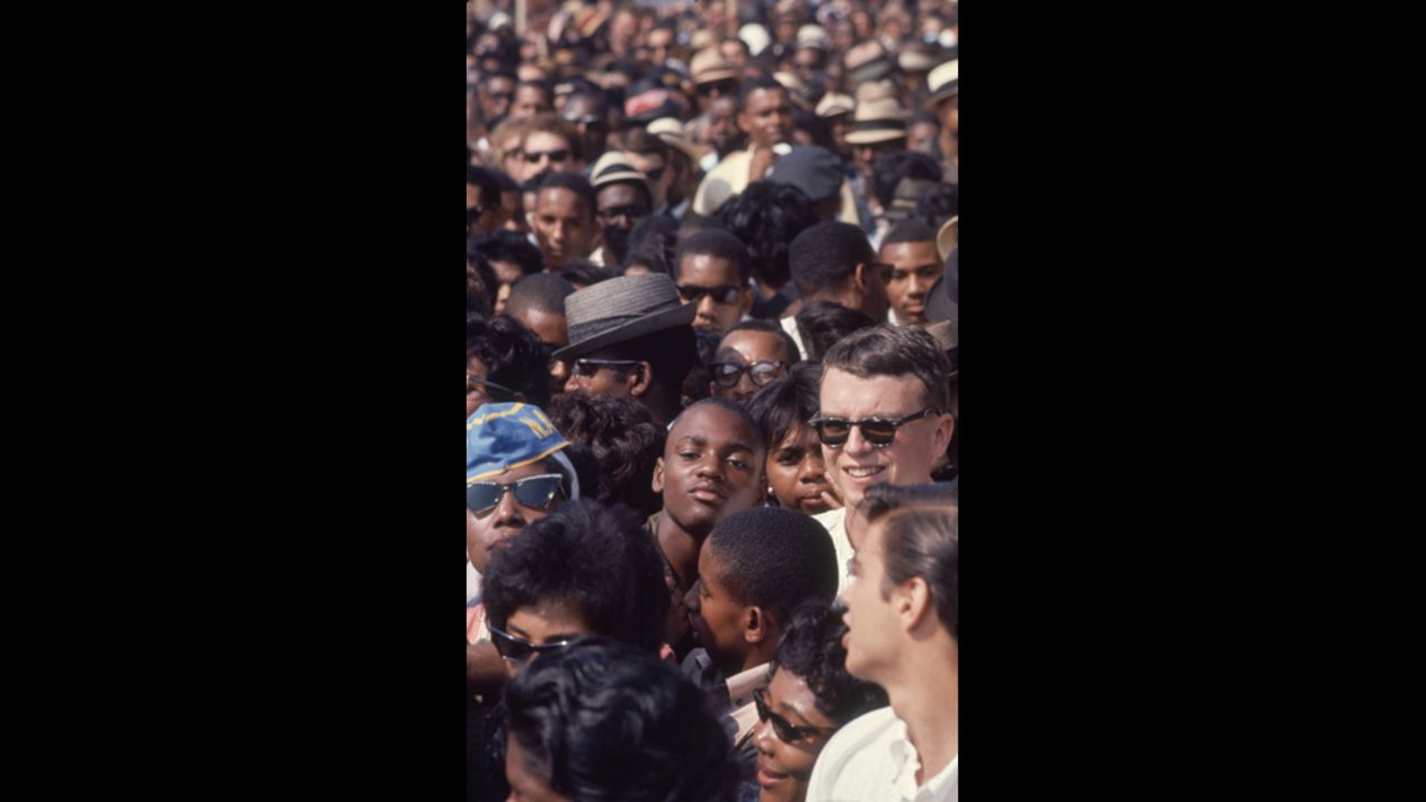 Demonstrators crowd together as they listen to civil rights speakers during the rally.