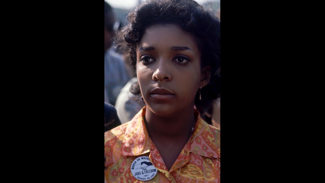 A woman attends the rally.