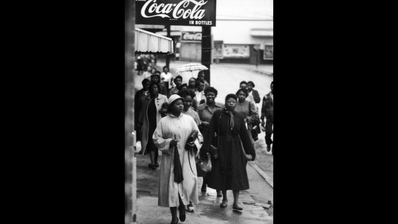 African American women walk along the sidewalk during a bus boycott, Montgomery, Alabama, February 1956.