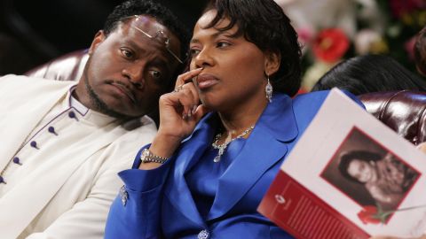 Bernice King confers with Bishop Eddie Long during a 2006 funeral service for her mother at Long's church.
