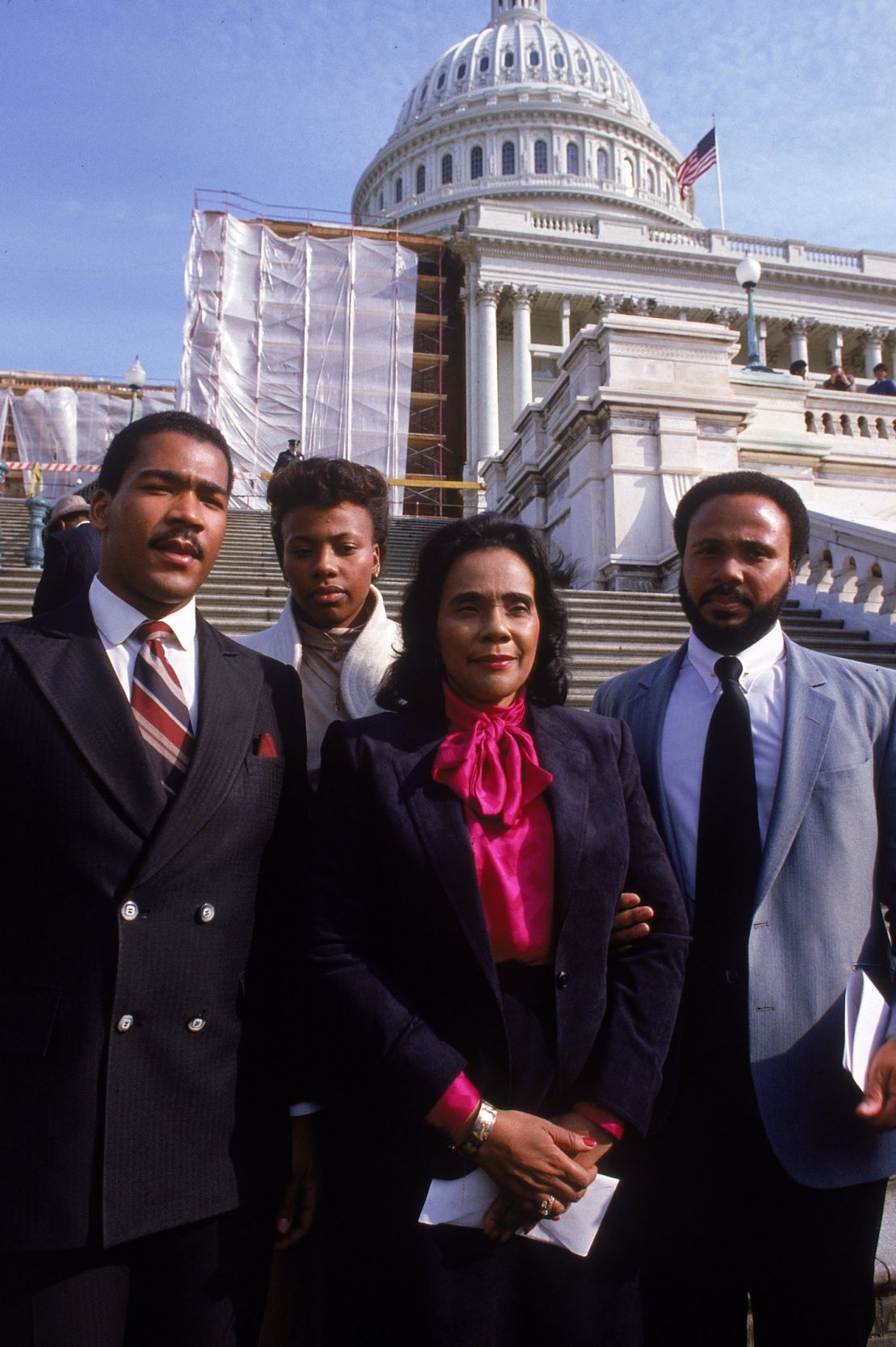King joins her mother and brothers Dexter, left, and Martin on the Capitol steps to mark the enactment of the King holiday.