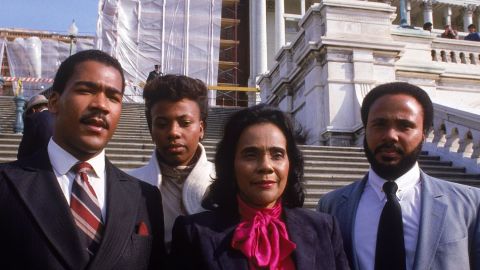 King joins her mother and brothers Dexter, left, and Martin on the Capitol steps to mark the enactment of the King holiday.