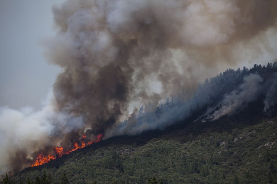 Smoke and flames move along a ridge just outside Yosemite National Park on August 24. 
