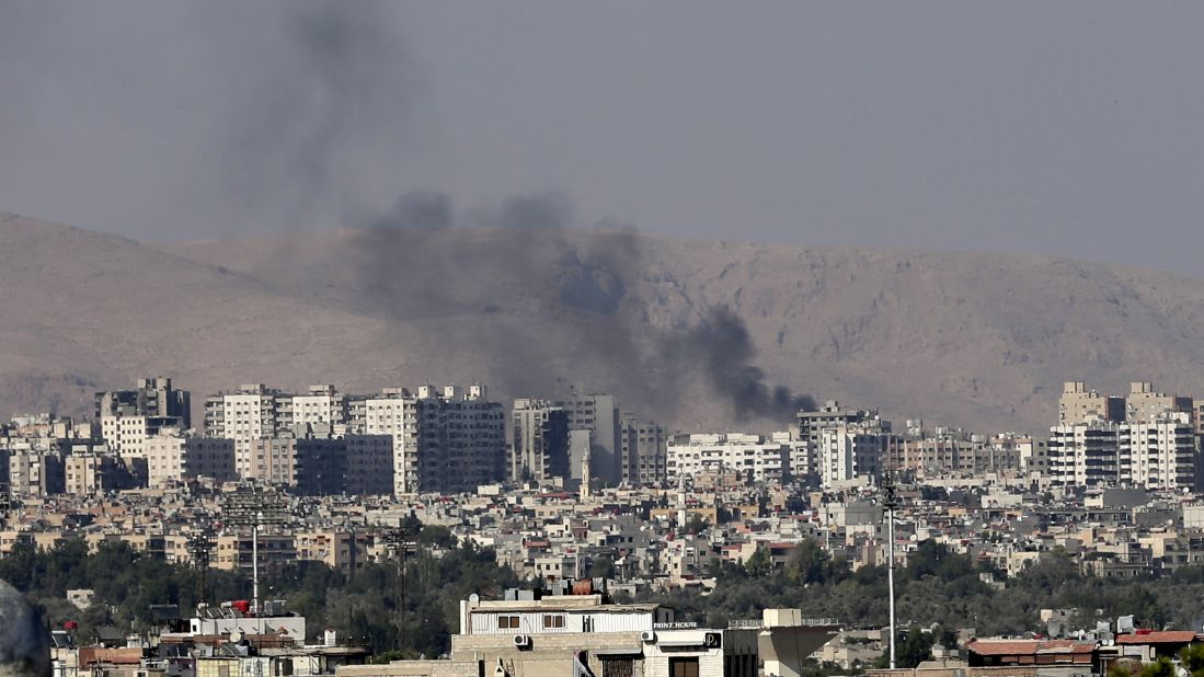 Columns of smoke rise in Barzeh after heavy shelling on Friday, August 23.