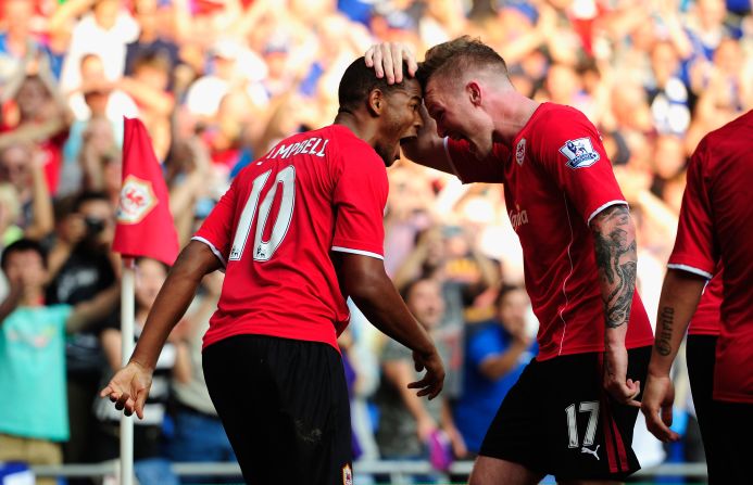 The former Manchester United player netted twice in the second half after Aron Gunnarsson (right) had canceled out Edin Dzeko's opener.