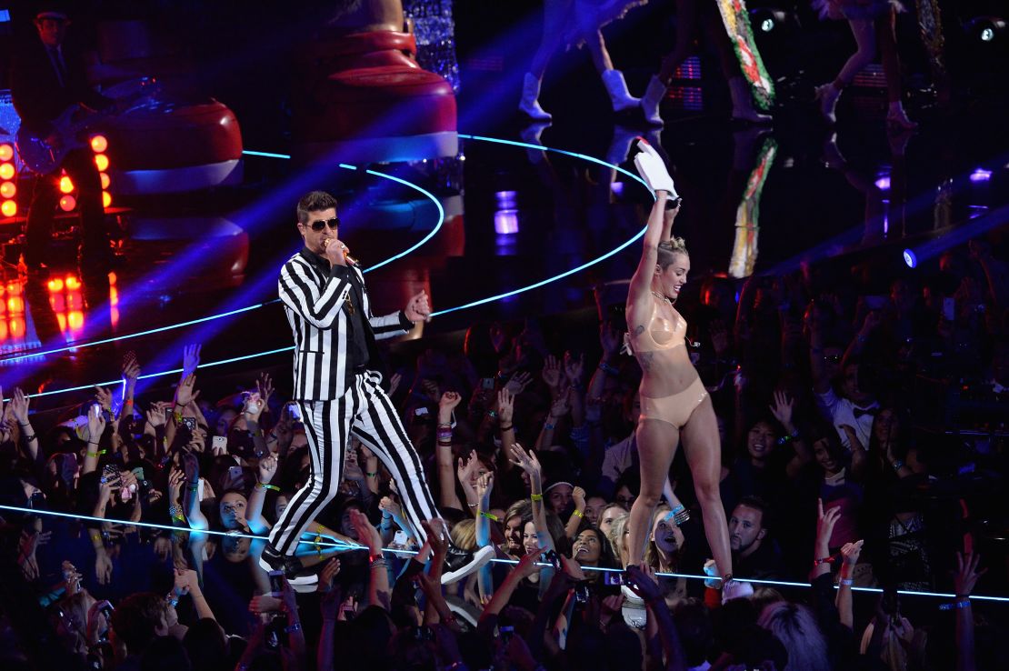 Robin Thicke and Miley Cyrus, right, perform onstage during the 2013 MTV Video Music Awards at the Barclays Center on Sunday, August 25, in the Brooklyn, New York.