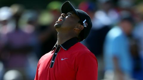 Tiger Woods reacts after missing a putt on the 12th hole during the final round of The Barclays at Liberty National Golf Club.
