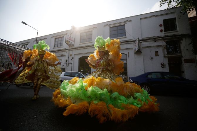 Members of the Paraiso Samba troupe line up for the <a  target="_blank" target="_blank">Notting Hill Carnival</a> in London on Monday,  August 26. More than 1 million people are expected to take part in what organizers call the largest street festival of its kind in Europe.