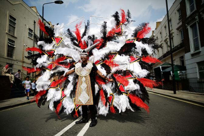Revelers in costume perform in London on August 25. The Notting Carnival first began nearly 50 years ago as a way for the Afro-Caribbean community to showcase their traditions and cultures.