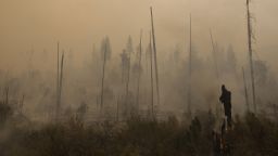 AUGUST 26 - CALIFORNIA, UNITED STATES: Smoke rises from smoldering trees as <a href="index.php?page=&url=http%3A%2F%2Fcnn.com%2F2013%2F08%2F26%2Fus%2Fcalifornia-yosemite-wildfire%2Findex.html%3Fhpt%3Dhp_t3">more than 3,400 firefighters battle the Rim Fire near Yosemite National Park</a> on Sunday, August 25. The wildfire has become the <a href="index.php?page=&url=https%3A%2F%2Ftwitter.com%2FCALFIRE_PIO%2Fstatuses%2F371822607345016833" target="_blank" target="_blank">14th largest in state history</a>, devouring nearly 144,000 acres and an area about the size of the city of Chicago.