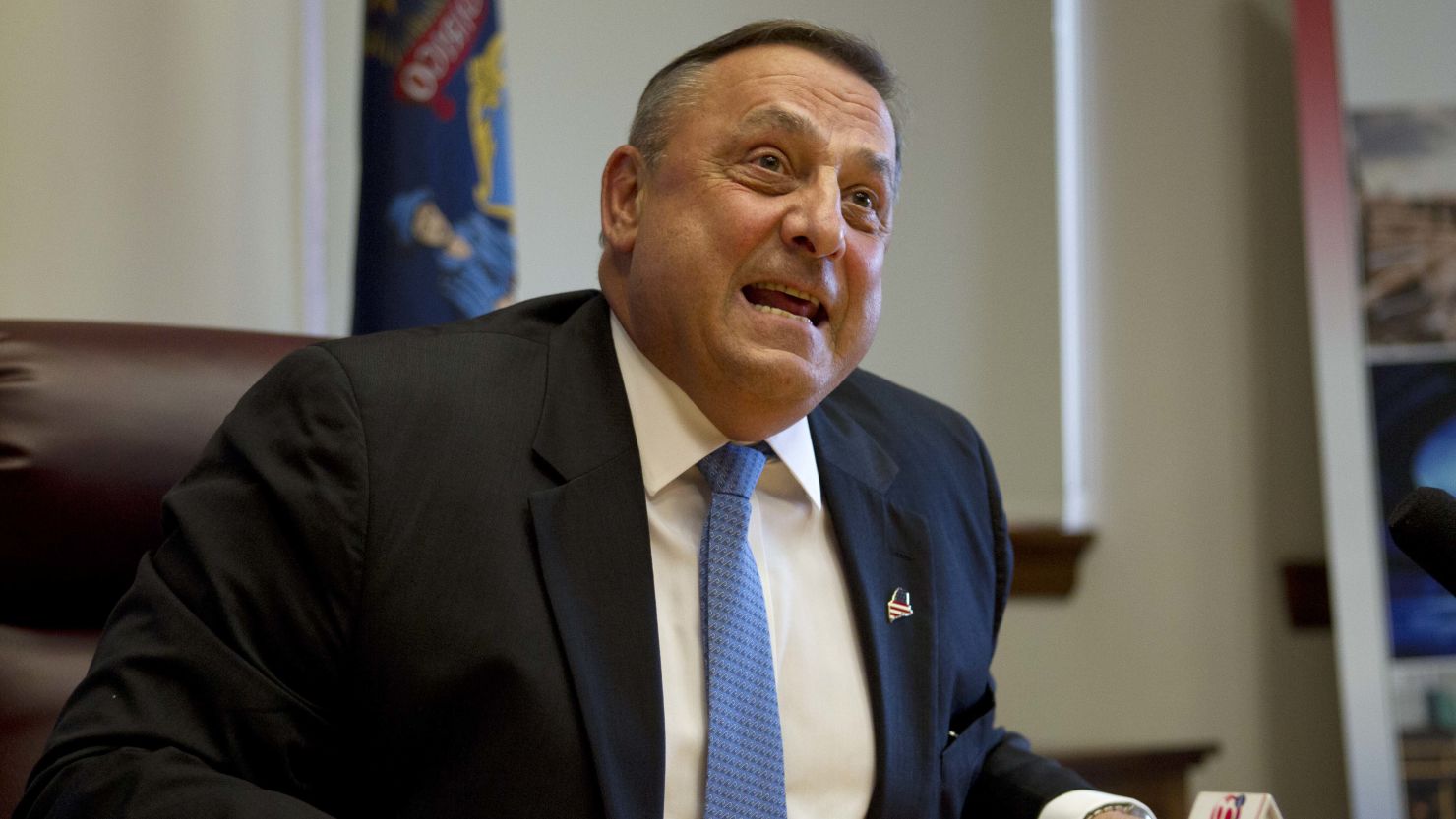 Gov. Paul LePage speaks to reporters after the Maine House and Senate overrode his veto of the state budget on June 26.
