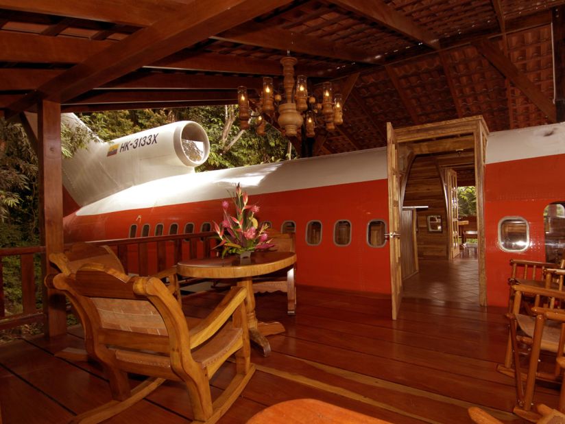 The emergency door on the 727 leads to a relaxing lunch area on the patio, built above the right wing of the airplane. Unexpected guests may include sloths and monkeys. 